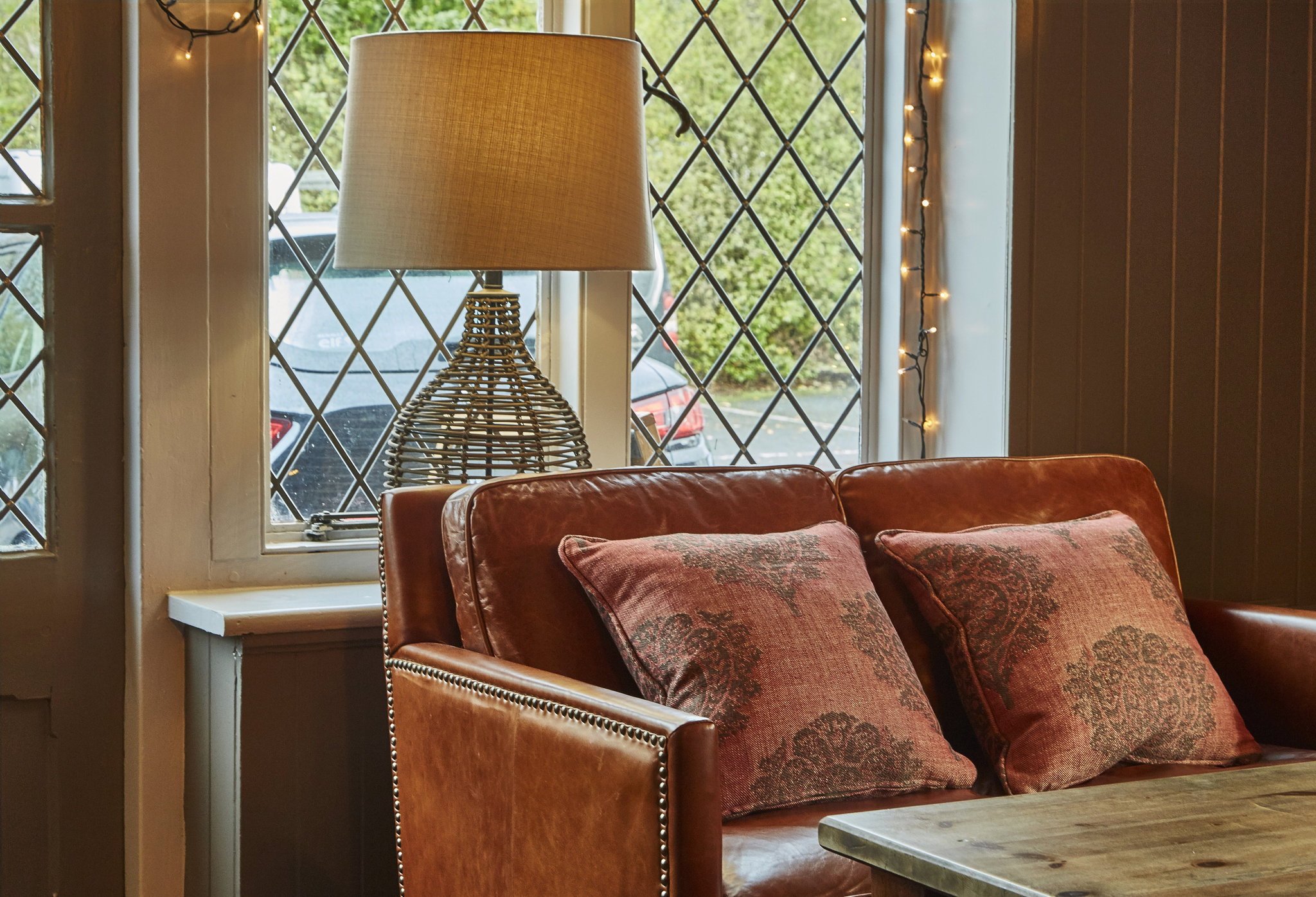 Ely_Refurb_leather_sofa_in_window_S