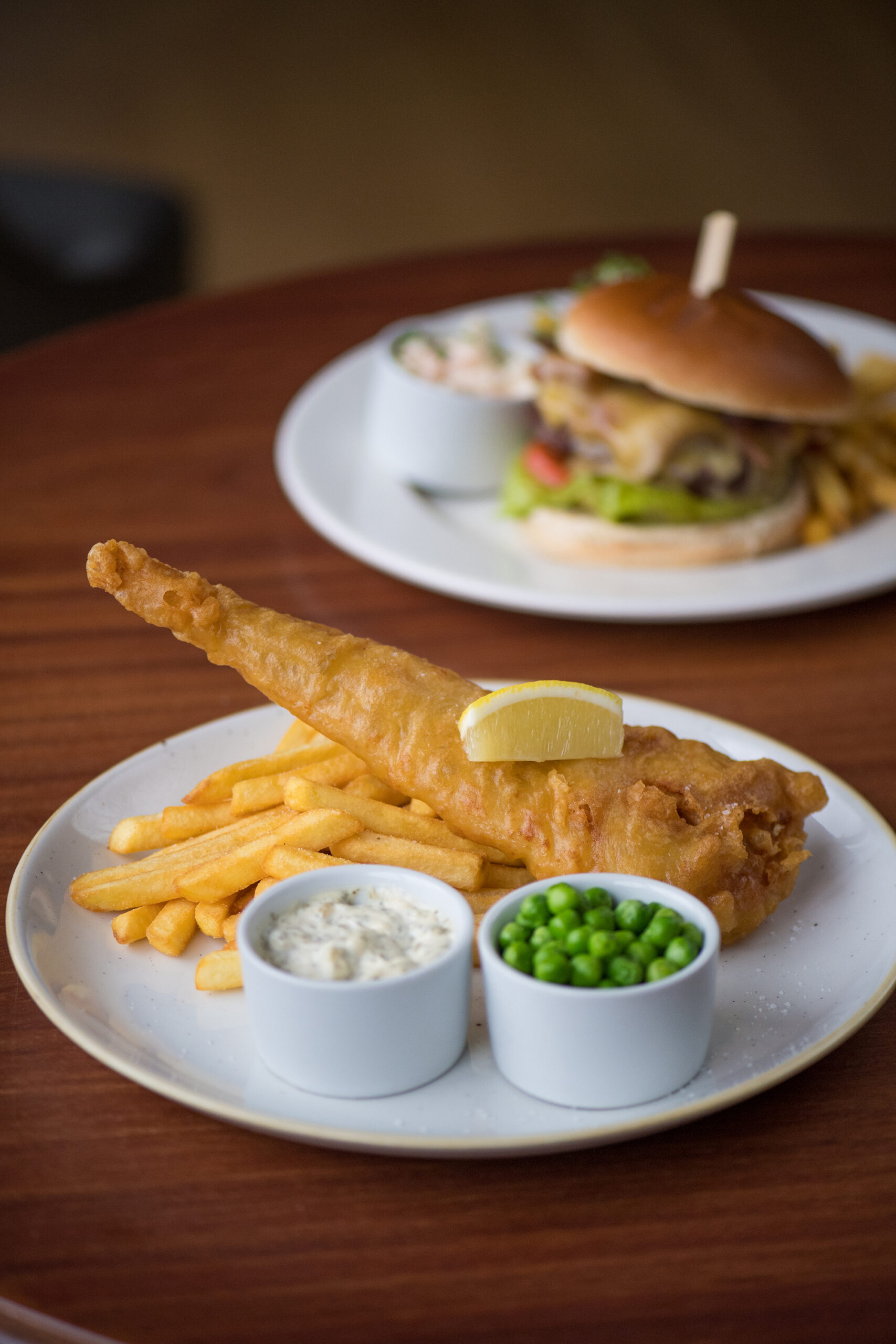 fish-and-chips-with-burger-in-background