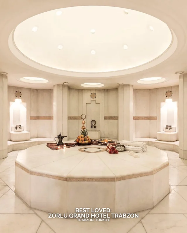 Zorlu Grand Hotel stands in the centre of Trabzon on the Turkish Black Sea Riviera. The hotel has a strong sense of place, polished interiors and spacious rooms with warm textures. The lobby sets the tone with soft lighting and generous seating. The location places you close to the waterfront, local cafés and historic streets, creating an easy rhythm between exploring and returning to rest. The spa and indoor pool offer a calm atmosphere, and dining highlights regional Black Sea flavours alongside international classics. The hotel works well for travellers who appreciate consistency, service and a clear connection to the city.

What captures your attention here: the coastal location or the elegant city setting?

#BestLovedHotels #hotels #travel #turkey