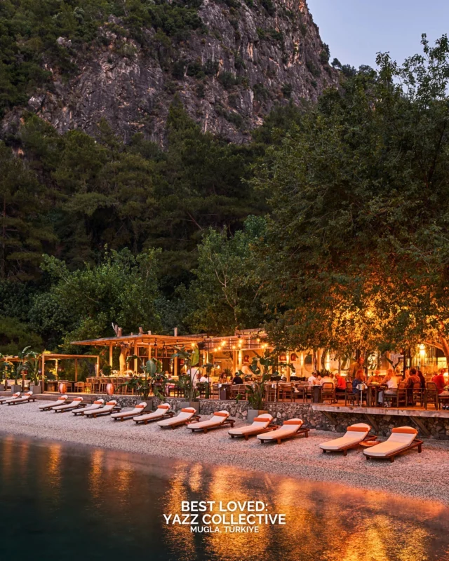 Yazz Collective sits inside a private bay in Fethiye, reached by boat, which gives the arrival a sense of occasion. Sixteen guest houses are set among gardens, creating privacy and quiet space. Days move between the beach, the water and the restaurant, where menus are built around seasonal produce and sharing plates led by Executive Chef Mustafa Otar. Cocktails are mixed with attention to detail, using fresh fruit and house infusions. The gallery on-site brings in artists and sculptors, giving the property a cultural layer. On weekends, DJs set the tone for evenings that draw in both travellers and the yacht crowd. The atmosphere is social, relaxed and distinct to this coastline.

What would draw you first: the bay, the food or the weekend energy?

#BestLovedHotels #hotels #travel #turkey