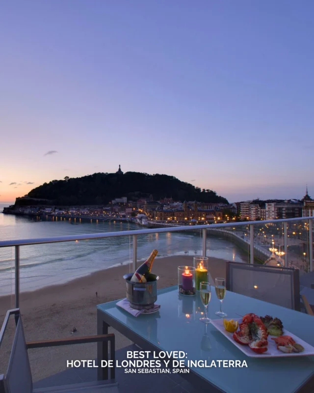 Overlooking the curve of La Concha Beach, Hotel de Londres y de Inglaterra has welcomed visitors to the Basque coast for more than 150 years. The historic building stands between the promenade and the narrow streets of San Sebastián Old Town, placing guests within easy reach of the city’s renowned pintxos bars and boutiques.

Inside, 166 rooms combine Belle Époque architecture with modern comfort, many facing the bay and the Cantabrian Sea beyond. Several restored salons host private gatherings, celebrations and meetings with natural light and coastal views. Dining remains rooted in local tradition, with chef Mikel Ibero presenting seasonal Basque dishes shaped by regional produce.

For a stay in San Sebastián, would the bay view or the restaurant table be the first reservation?

#BestLovedHotels #hotels #travel #spain #sansebastian