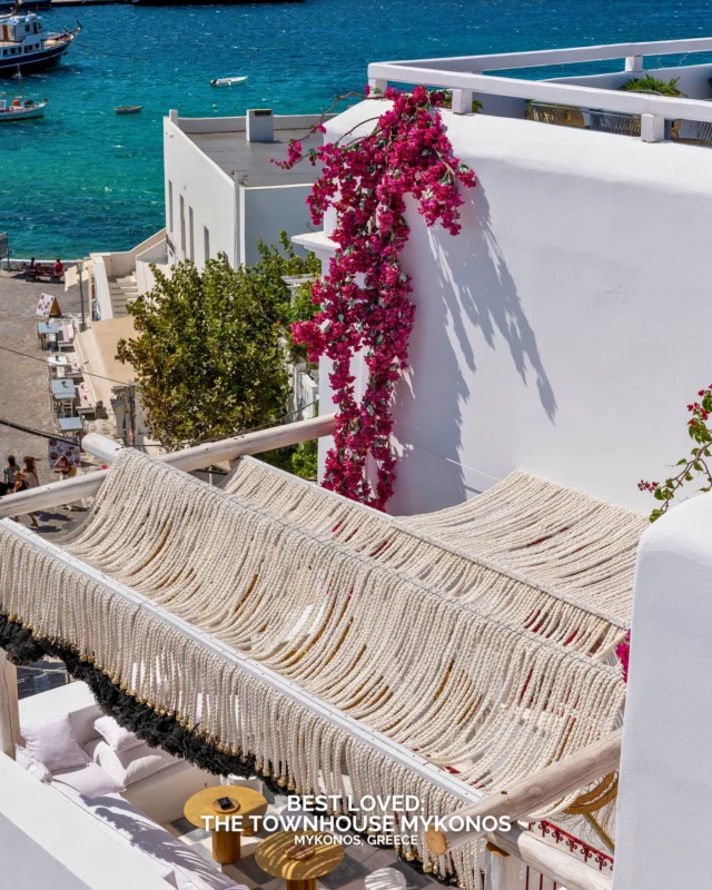 In the centre of Mykonos Town, just above the harbour, Mykonos Townhouse occupies a restored eighteenth-century Cycladic residence. The address places guests directly inside the maze of white streets while keeping the scale unusually small for the island. Only nineteen rooms sit within the building, and the hotel recently earned a Michelin Key.

Rooms range from compact superior spaces to larger duplex suites and seafront rooms overlooking the Aegean. Interiors stay clean and contemporary, allowing the original architecture to shape the atmosphere.

Breakfast is served across terraces facing the harbour with Greek yoghurt, honey and fresh bread from local producers. Later in the day, the rooftop SKYBAR draws guests for cocktails and sunset views before the evening moves downstairs to 54 Bar.

Would Mykonos Townhouse make your Mykonos hotel shortlist?

#BestLovedHotels #hotels #travel #mykonos #greece